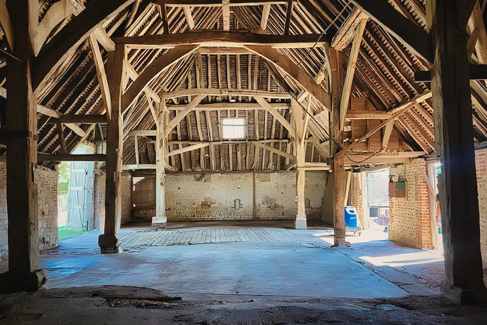Spacious timber-framed barn interior, ample light