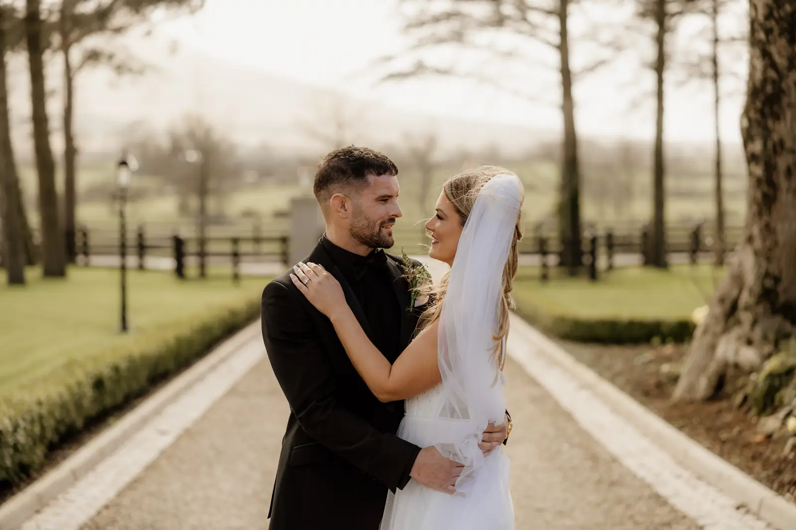 Bride and groom sharing a quiet moment on the Ballyness driveway