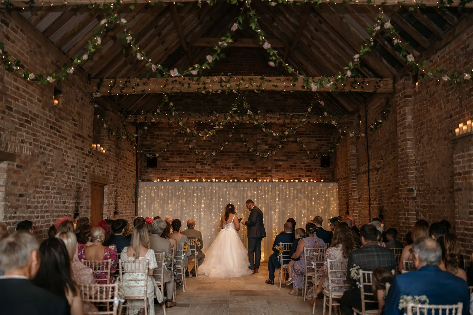 Bride and groom during a ceremony in the Ceremony Barn