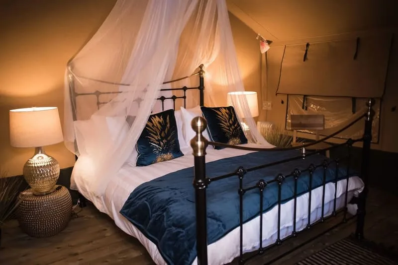 Bed inside an Alswick glamping tent